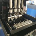 Semi-automatic 4 cavity PET bottle blow molding machine with DELTA PLC