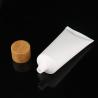 Buy cheap wholesale empty 30ml plastic soft cosmetic tube, 60ml plastic white cream tube with bamboo cap, empty PET soft tube from wholesalers