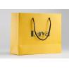 Buy cheap Yellow Matte Paper Shopping Bags Nylon Handle And Customized Logo Printed from wholesalers