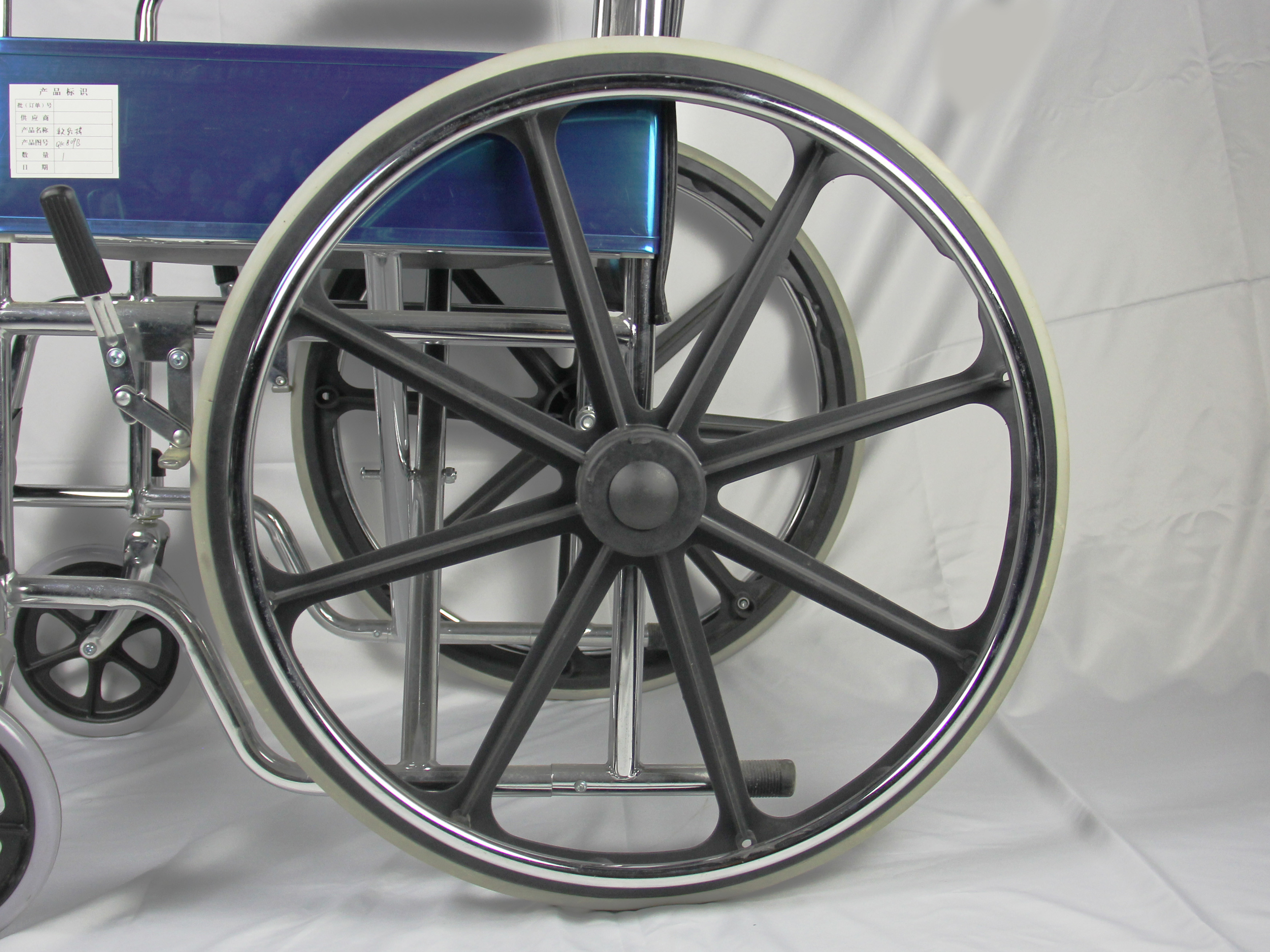 ISO Foldable Steel Wheelchair With Solid Castor Rear Wheel