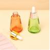 Buy cheap Industrial Cosmetic Elegant 30ml 50ml 1oz 2oz Green Empty Oil Serum Dropper Bottles with Box Customize Unique Cone Shape from wholesalers