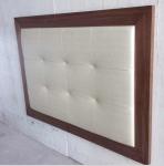 Wood frame fabric upholstery button tufted king size headboard of hotel bedroom