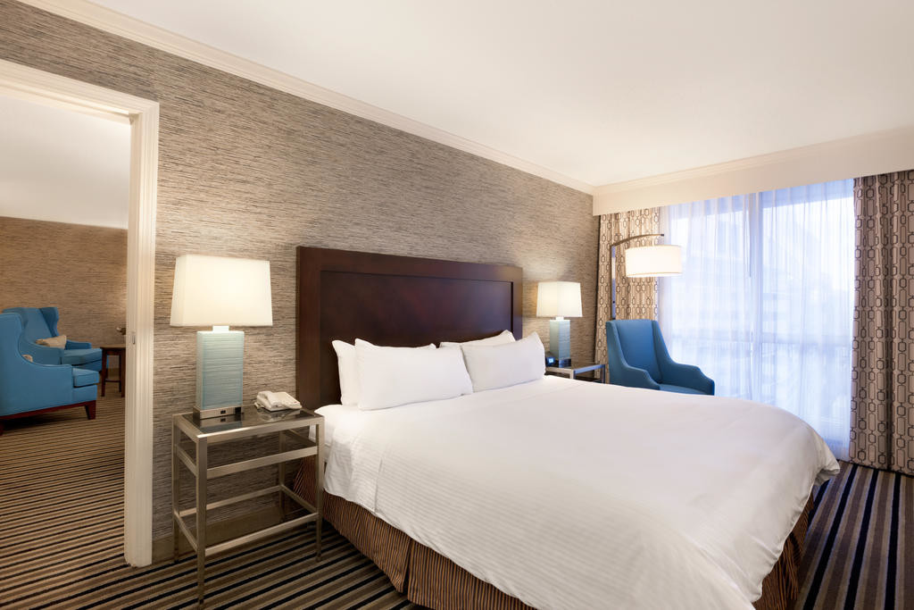 laminated Oak wood Hotel bedroom Furniture sets Tall headboard with Fabric upholstered padded and TV units Contemporary