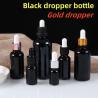 Buy cheap 5ml 10ml 15ml 20ml Essential Oil Serum Flat Shoulder Round Shiny essential oil bottle Black Glass Dropper Bottle from wholesalers
