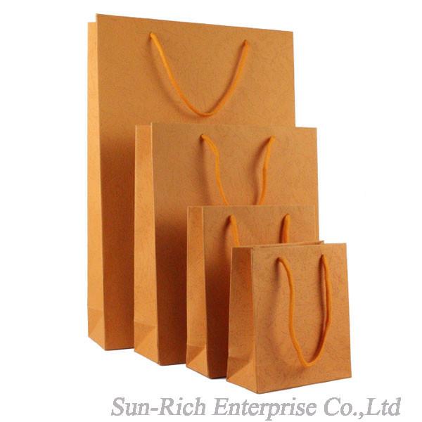 Buy cheap Wholesale Orange color paper bag gift bag Custom Logo available from wholesalers
