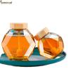 Buy cheap 380ML Glass Honey Hexagon Jar With Wooden Cover And Wooden Splash Bar from wholesalers
