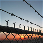 chain-link fence (also referred to as wire netting, wire-mesh fence, chain-wire fence, cyclone fence, hurricane fence, o