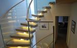 Stainless Steel Curved Glass Staircase Modern House Decoration With Wall Mounted