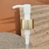 Buy cheap 24/410 Long Nozzle Plastic Cosmetic Lotion Pump Gold Aluminum Closure Metal Shell With Clip from wholesalers