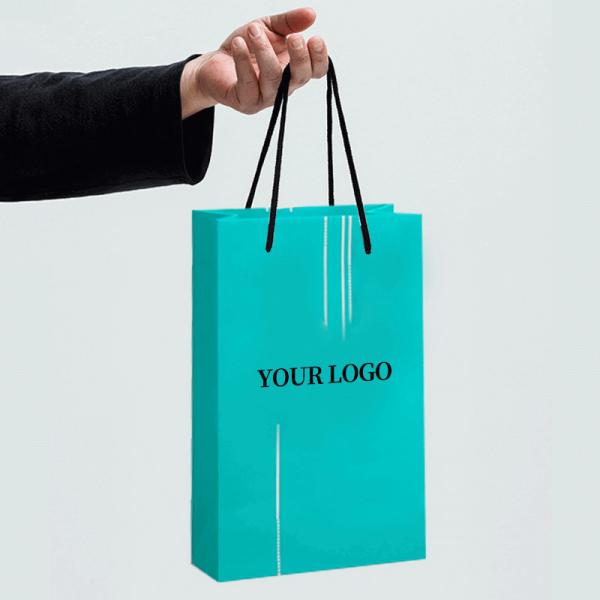 Buy cheap Customized High-end Hand held Gift Bags Clothing Store Personalized Craft Kraft Paper Bags Gift Packaging from wholesalers