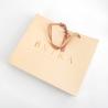 Buy cheap Hand Length Handle Customized Logo Clothing Garment Peach Paper Bag with Ribbon from wholesalers