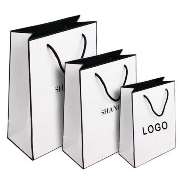 Buy cheap Free Design Beautiful Custom Logo Printing Art Paper Bag Gift Clothing Shipping Bag With Handle from wholesalers