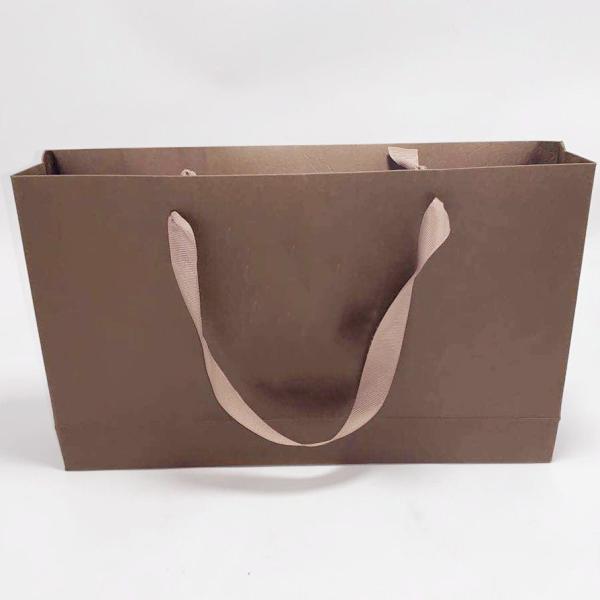 Buy cheap High End Kraft Paper Bag Printed Ribbon Handle Bags Carry Gift 31.5 X 6.4 X 19cm from wholesalers