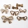 Buy cheap ODM Handbag Metal Tags Durable Embossed Brass Antirust Bow Knot Shape Purse Label from wholesalers