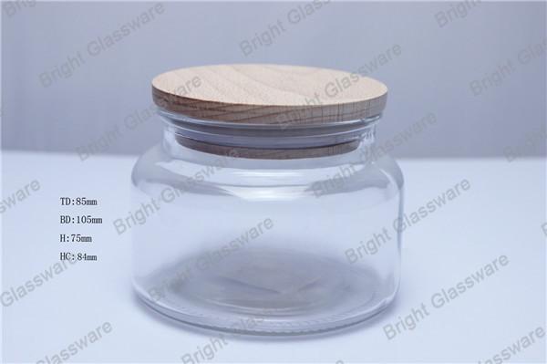 Buy cheap hot sale design clear glass candle jar with wooden lid for sale from wholesalers