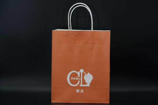 Buy cheap Custom Orange Eco Paper Bags With Handles Twisted Solid Plate Printing from wholesalers