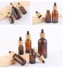 Buy cheap Glossy Amber Color Bamboo Essential Oil Glass Dropper Bottle Wood Cap Glass Cosmetic Containers from wholesalers