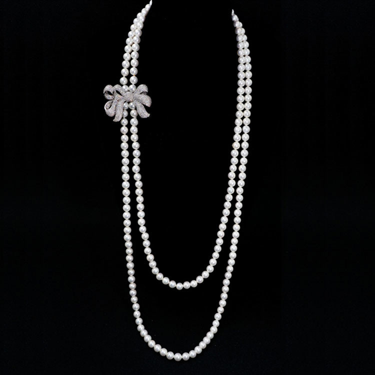 Women White Shell Pearl Double Strands Sweater Necklace with Cubic Zirconia Bow Charm (SN702143BOW)