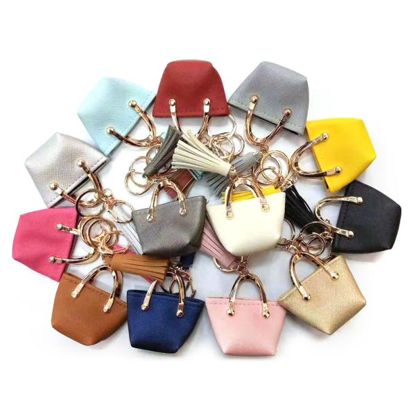 Buy cheap OEM 35g Brown Mini Purse Keychain , PU Leather Small Coin Pouch Keychain from wholesalers