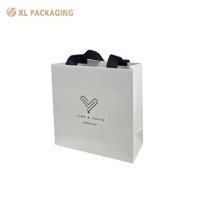 China Wholesale Custom Pantone Color Disposable Hotel Using Paper Bag With Golden Strings Handle on sale