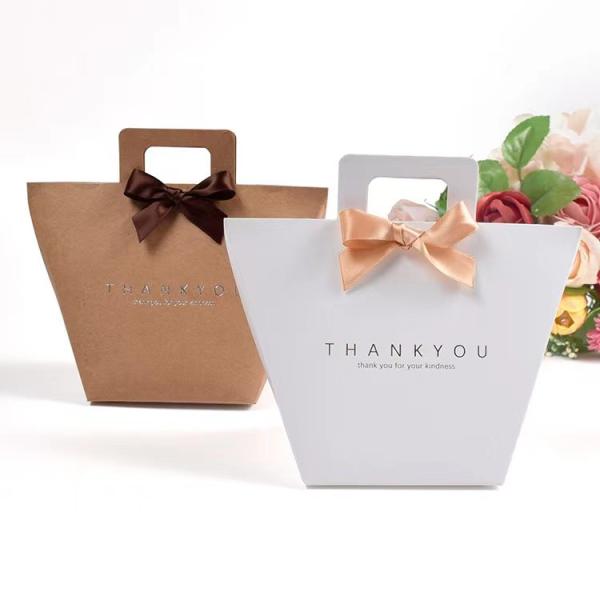 Buy cheap Custom Logo White Kraft Present Paper Bags 9.5*9*12cm French Gift Bag With Ribbon from wholesalers