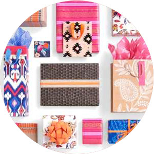 Colorful gift bags with tissue paper & gift boxes in pink, blue, purple, peach, flowers and stripes