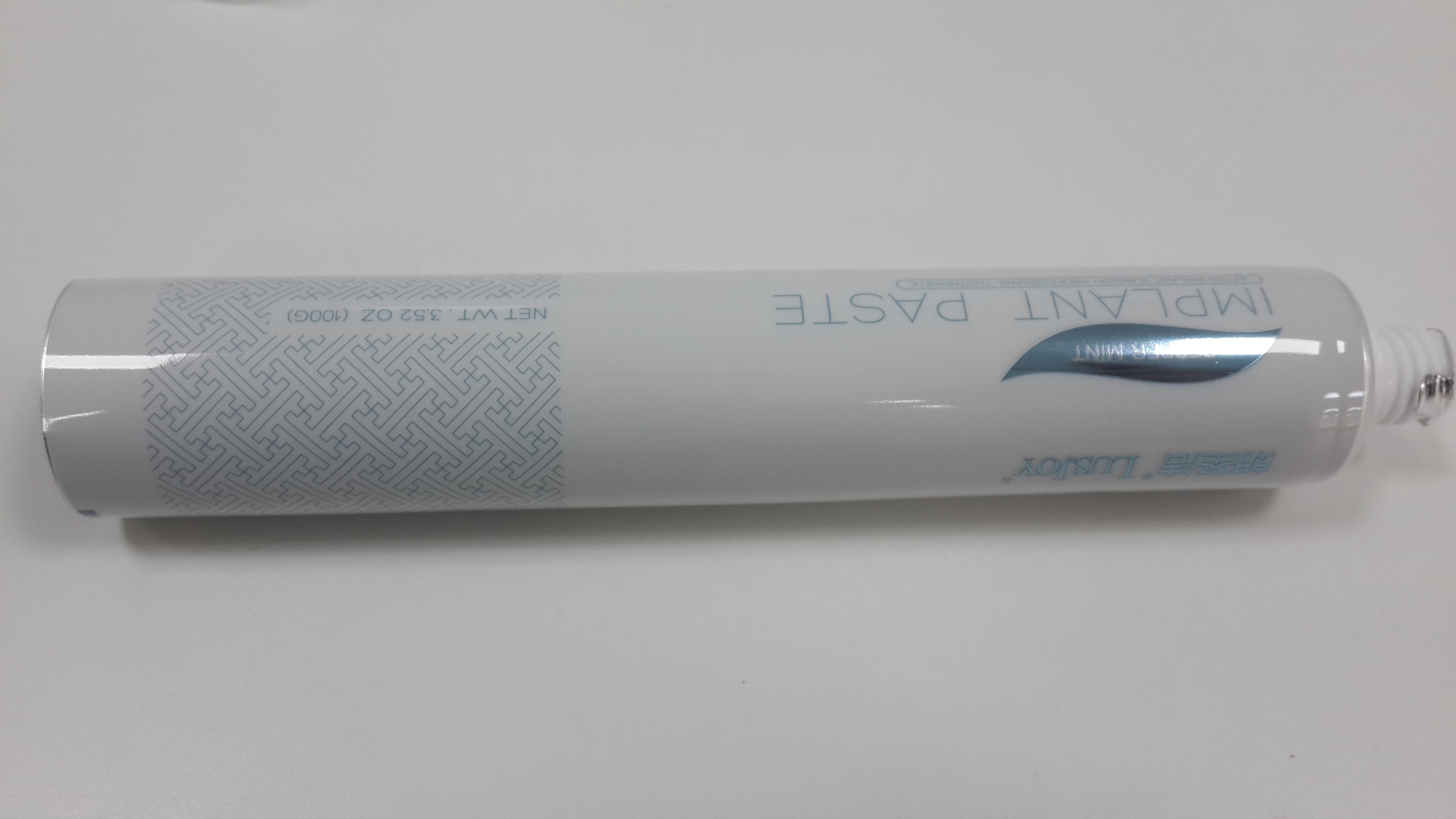 Soft touch material Dental care toothpaste Containers with Fez cap , 100G