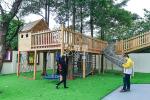Kindergarten wooden tree house outdoor playground equipment with climbing net