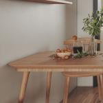 A modern, functional and easily installed wooden dining table for an apartment