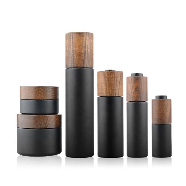 Buy cheap New Developed Wooden Bamboo Cap Round Dark Violet Glass Bottle with lotion pump from wholesalers