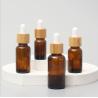 Buy cheap Glossy Amber Color Bamboo Essential Oil Glass Dropper Bottle Wood Cap Glass Cosmetic Containers from wholesalers
