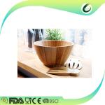 wooden bamboo salad bowls with serving hands and serving bowls